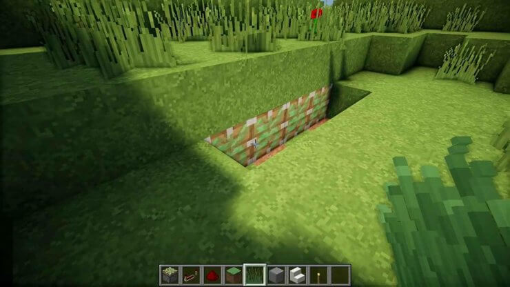 Kéo khối cỏ ra để mở cửa hầm trong Minecraft