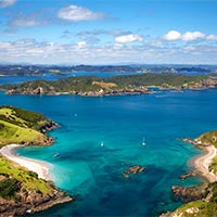 Write a postcard telling your friend about Bay of Islands